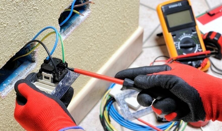 Wiring an electrical outlet.